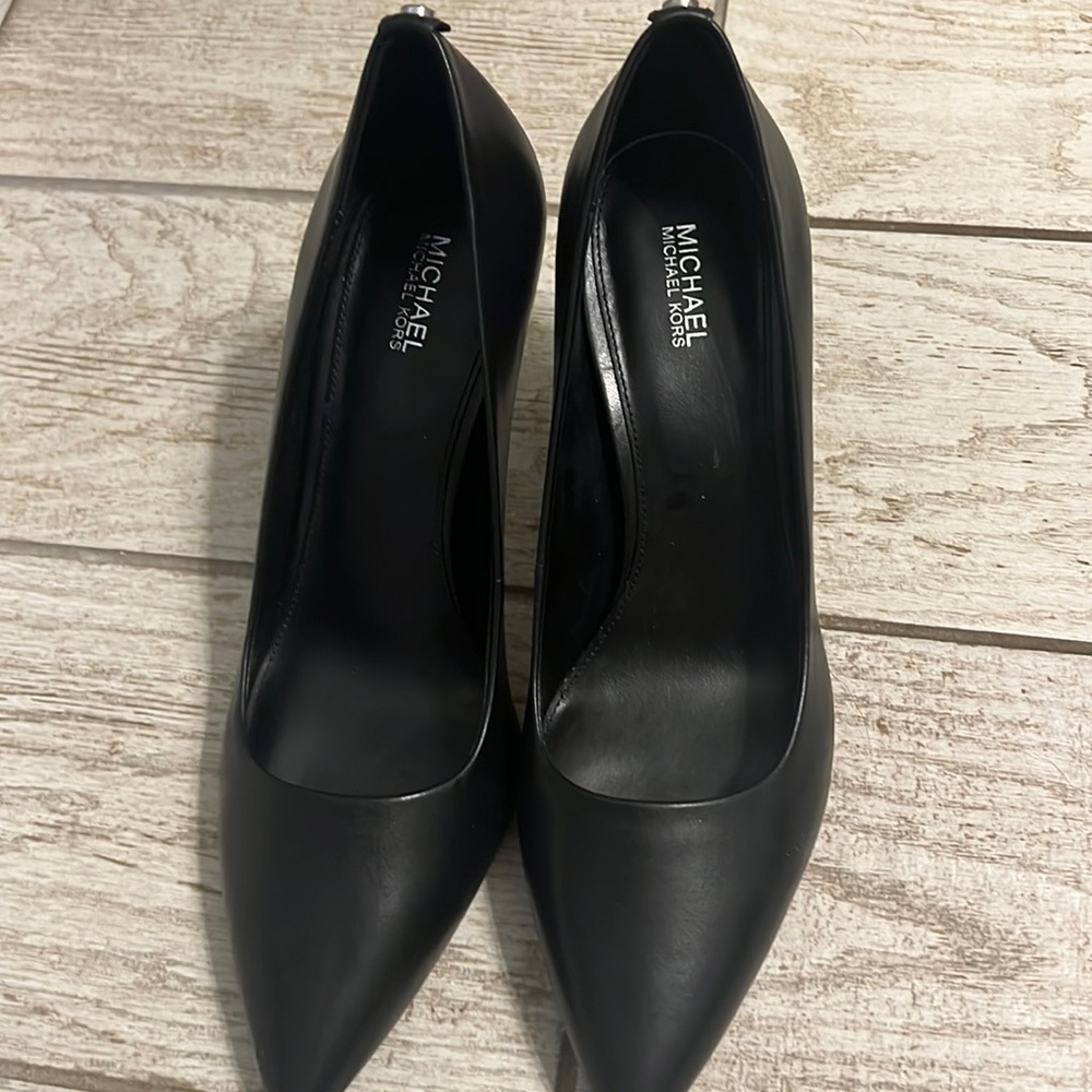 Never worn. New without box Michael Kors high heels